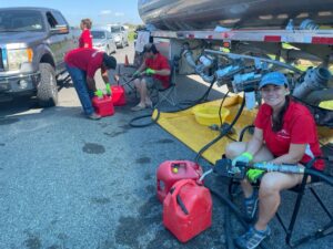 Photo of volunteers filling up gas cans