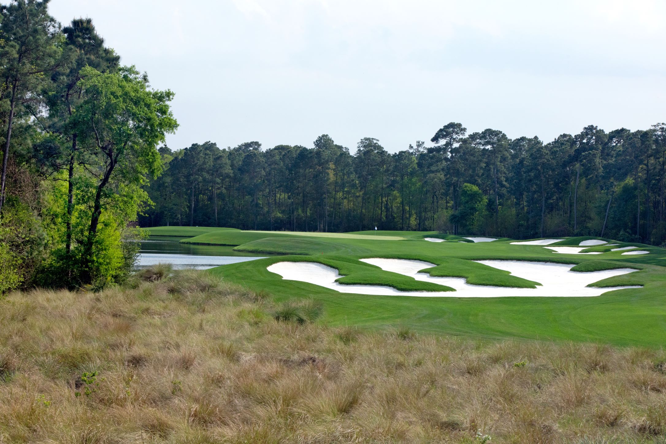 GCOH #4 Hole resized Distance shot of sand traps and a hole at the Golf Club of Houston
