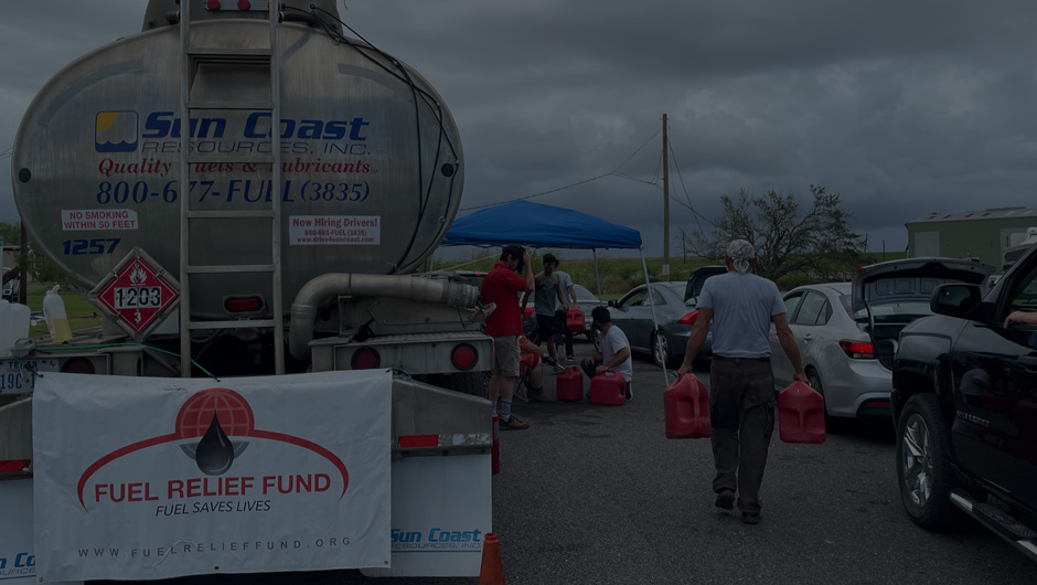Volunteers gathering fuel jugs after Hurricane Ida